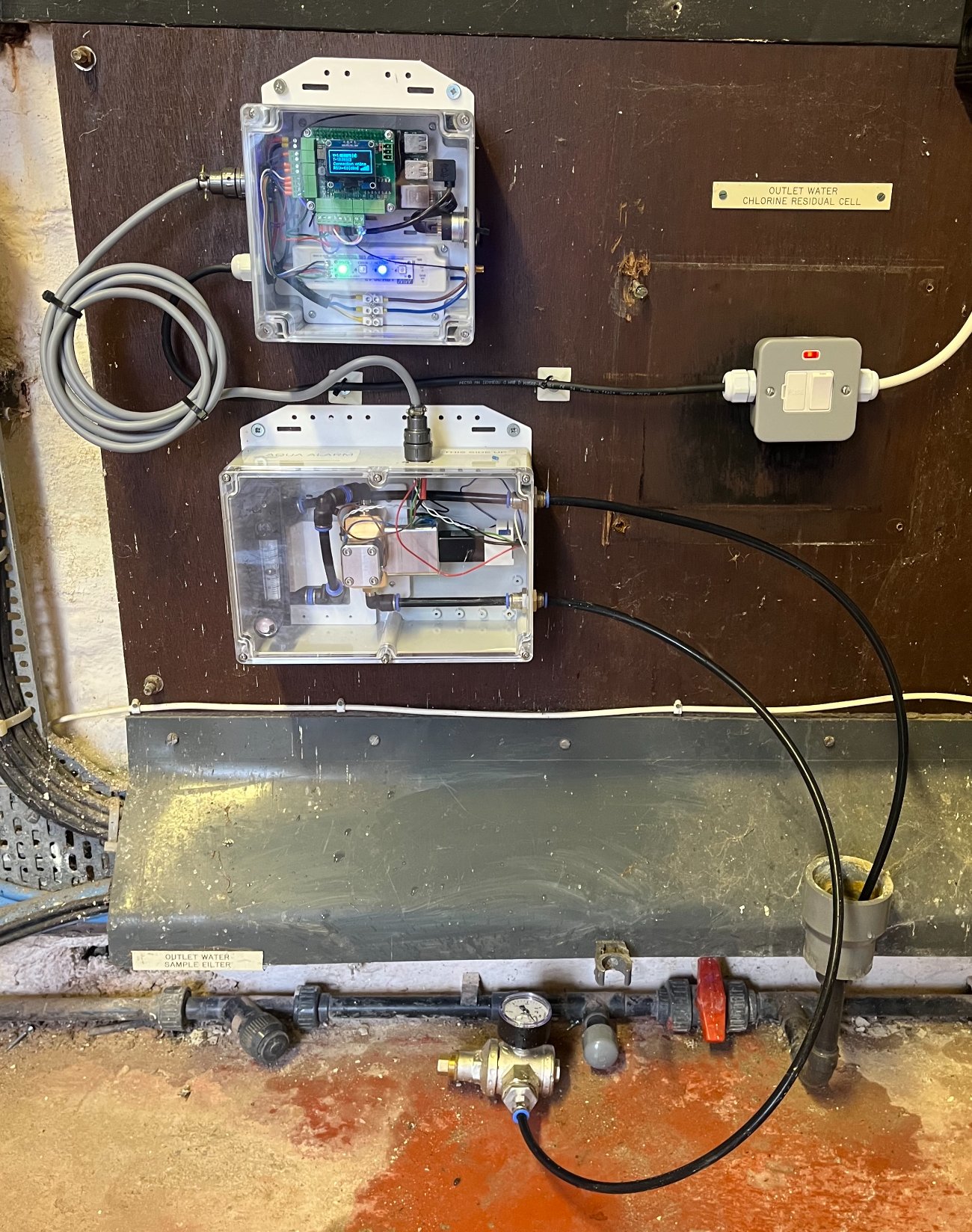 Aqua Alarm sensor and auto-sampler units installed on the outlet-water sample line at a service reservoir
